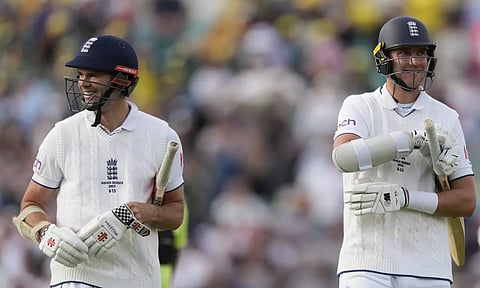 England's James Anderson (left) and England's Stuart Broad (right) leaves the pitch at the end of play on day three of the fifth Ashes Test match between England and Australia, at The Oval cricket ground in London. (AP)