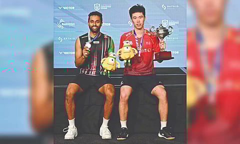 Weng Hongyang and HS Prannoy pose with their medals.