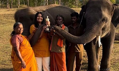 Bomman and Bellie, the mahout couple with filmmaker Kartiki Gonsalves.