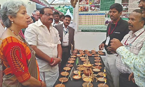 R Sakkarapani visiting stalls during the international conference on millets, on Sunday.