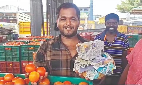 Farmer T Venkatesh all smiles with his earnings in Tirupur.