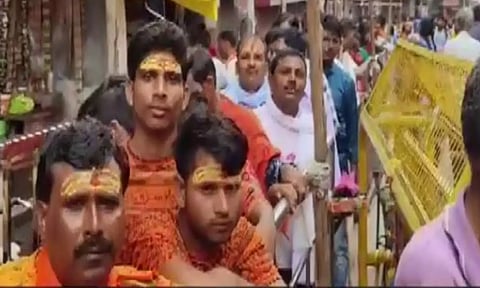 Devotees at Kashi Vishwanath temple (Photos: ANI)