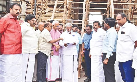 Ministers PK Sekarbabu and KN Nehru inspecting the damaged gopuram in Srirangam temple on Tuesday.