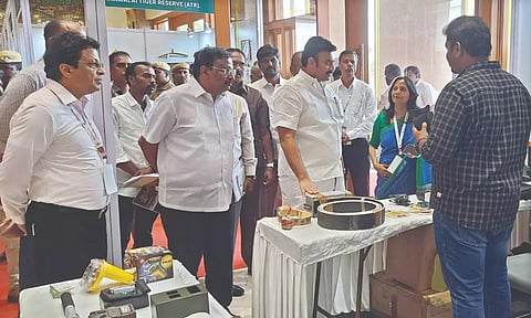 Minister M Mathiventhan looking at the exhibits at a conclave on elephants in Coimbatore on Friday.