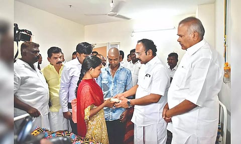 Speaker M Appavu, Minister Thennarasu consoling kin of attack victims and handing over solatium.