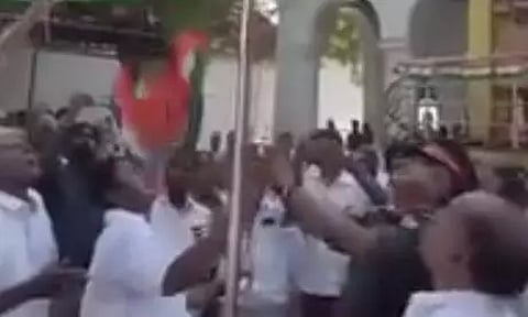 Screenshot of the flag falling down as MLA Anbalagan looks on in Kumbakonam on Tuesday