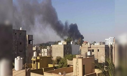 Smoke rises amid clashes between armed factions (Photo : ANI)