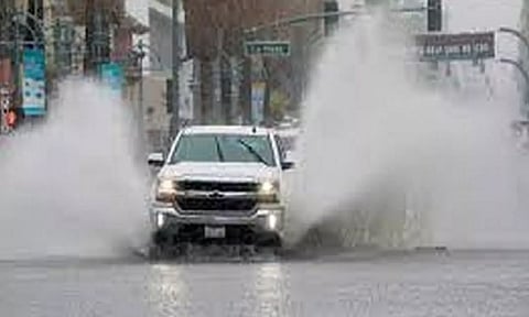 A truck moves through standing water as Tropical Storm Hilary approaches Palm Springs, California, US (Reuters)