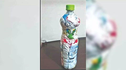 Bottle filled with plastics bags and packets