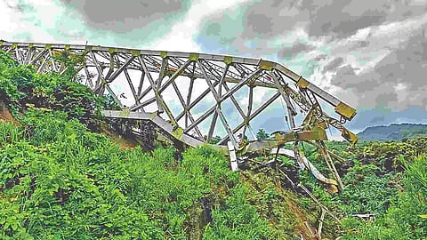 Locals at the site after an under-construction railway bridge at Sairang area collapsed in Mizoram