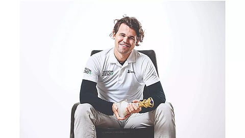 Magnus Carlsen is all smiles after his victory