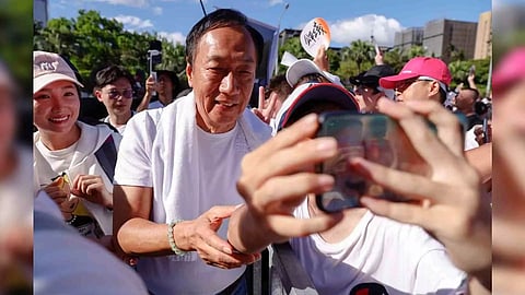 Supporters take a selfie with Terry Gou, the retired founder of major Apple supplier Foxconn (Photo/Reuters)