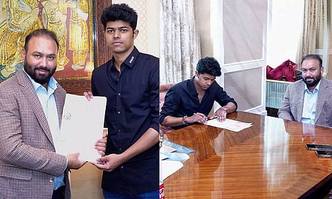 Jason signing the agreement in the presence of Subaskaran.