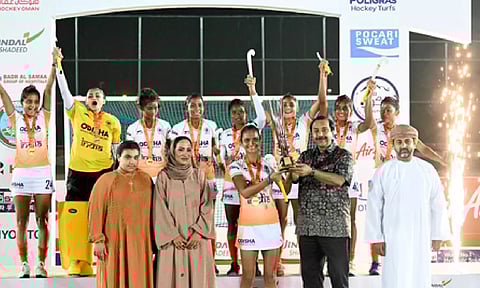 Navjot Kaur holding the trophy.