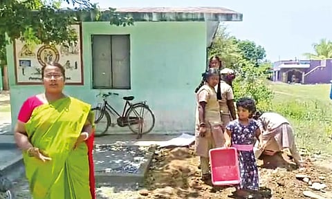 Students cleaning the campus of the middle school at Natrampalli in Tirupattur district without a compound wall