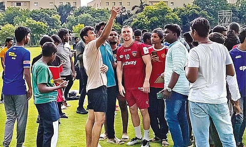 Connor Shields posing for pictures with fans