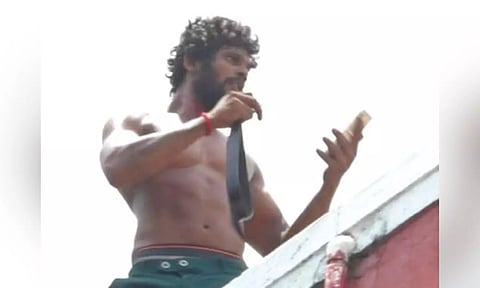 Surya threatening to jump off Pallavarm police station