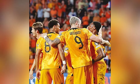 Netherlands players celebrating a goal against Greece