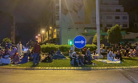 People gather on a street in Casablanca, following a powerful earthquake in Morocco