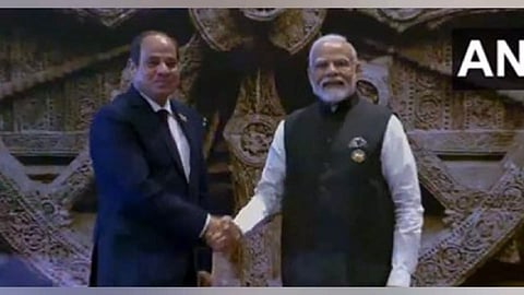 PM Narendra Modi shakes hand with Egyptian President
