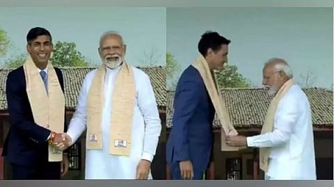 Prime Minister Narendra Modi welcomes UK PM Rishi Sunak and Canadian PM Justin Trudeau at Rajghat in New Delhi on Sunday. (Photo/ANI)