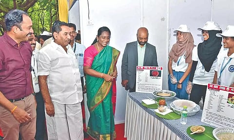 Collector MS Sangeetha looking at a millet food stall during an awareness programme in Madurai on Wednesday.