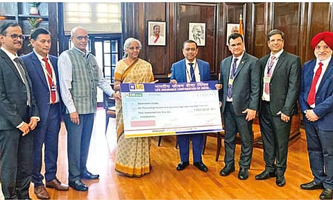 Siddhartha Mohanty, Chairperson of LIC presenting cheque to Finance Minister Nirmala Sitharaman