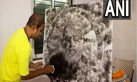 Smoke artist Deepak Biswal with portrait of PM Narendra Modi (Photo: ANI)