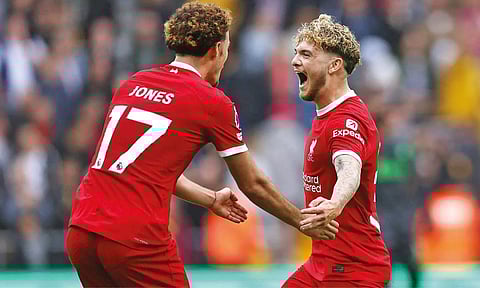 Harvey Elliott celebrates after his deflected shot makes it 3-1 for Liverpool