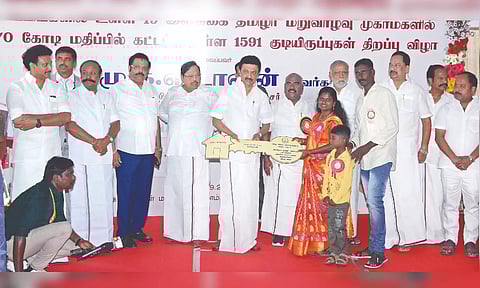 Chief Minister MK Stalin handing over a replica of the key to a beneficiary at Melmonavoor rehabilitation camp near Vellore on Sunday
