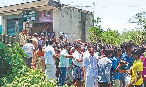 Residents stage protest seeking relocation of Tasmac outlet at Irumulai in Thanjavur district on Wednesday