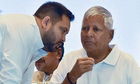 Former Bihar CM Lalu Prasad Yadav with son Tejashwi Yadav. (ANI)