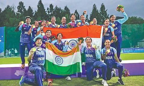 Women players celebrate after winning the women's cricket event