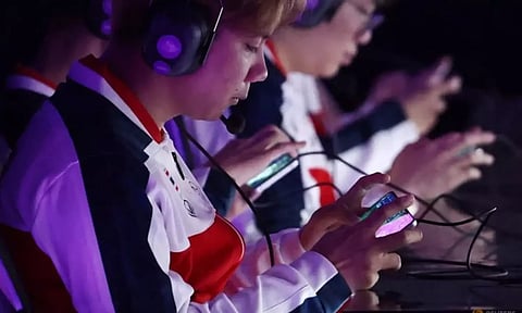 Players from Team Thailand prepare before the Arena of Valor Asian Games Version Bronze Medal Match. (Reuters)