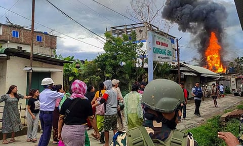 Smoke billows from a house torched by unidentified miscreants in Manipur (PTI)