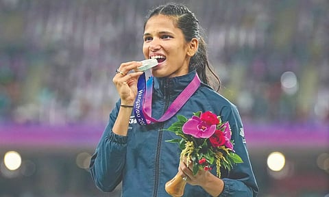 Jyothi Yarraji with the silver medal after her hard-fought victory