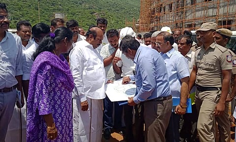 PWD Minister EV Velu inspecting jallikattu stadium works near Alanganallur in Madurai on Thursday