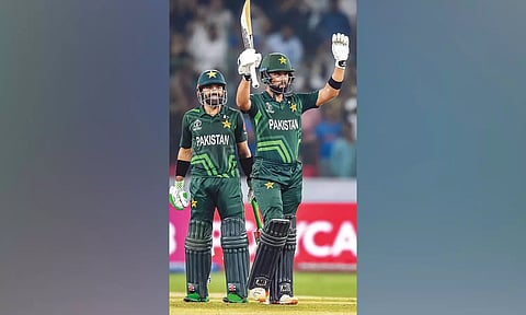 Abdullah Shafique raises his bat after scoring hundred against Sri Lanka