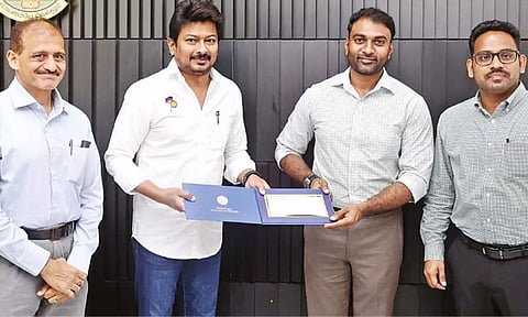 Minister Udhayanidhi Stalin presenting the grant to Formula Racing circuit panel member in Chennai on Friday