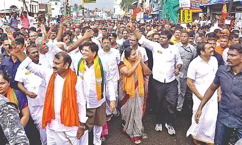 BJP State president K Annamalai, with party leaders, during his padayatra in Tirupur on Monday.