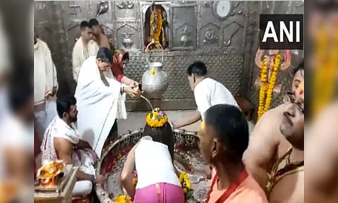 Tamil Nadu governor R N Ravi performing Jalabhishek to Baba Mahakal along with his wife