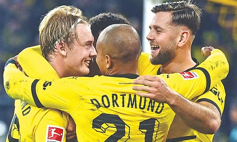 Julian Brandt (L) celebrates his goal with teammates during the match against SV Werder Bremen.
