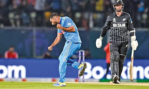 Mohammed Shami celebrates after taking the wicket of Matt Henry. Shami was named Player of the match