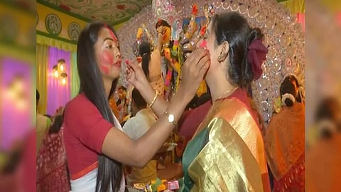 Two transwomen embrace each other and apply vermillion to each other (Image/ANI)