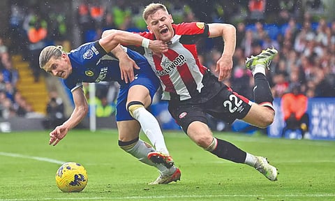 Chelsea’s Conor Gallagher (L) challenges Nathan Collins during the match