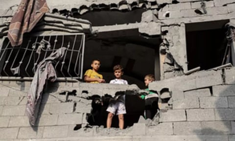 Victims standing in a damaged building.