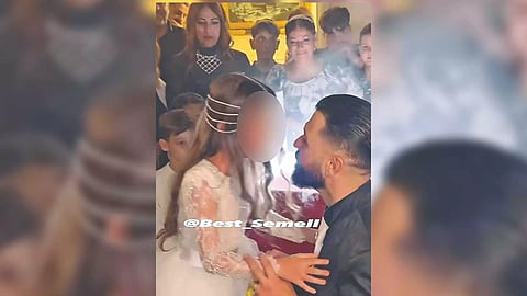 Man presenting a ring to a young girl