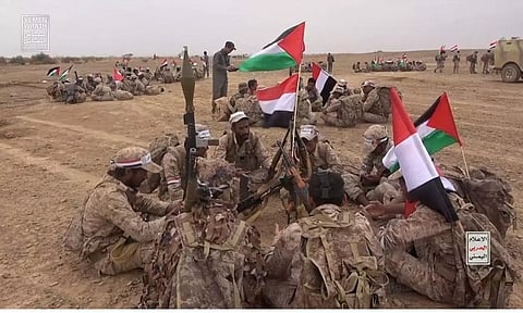 Houthi fighters gather during a military manoeuvre near Sanaa, Yemen (Photo: Reuters)