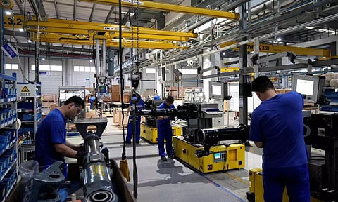 Workers working in auto manufacturing factory