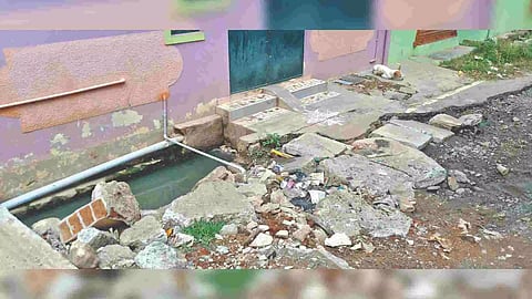 One of the damaged drains from which water enters houses when it overflows